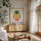 Blooming Beetle IV by Yvette St. Amant. Shown in a natural wood frame in a cozy modern living room. Available as an archival giclee rolled canvas, fine art paper, or poster print. SKU 90898a.