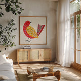 Blooming Bird I by Yvette St. Amant. Shown in a natural wood frame in a cozy modern living room. Available as an archival giclee rolled canvas, fine art paper, or poster print. SKU 92585a.