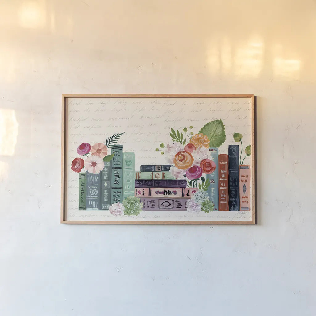 Blooming Books I by Yvette St. Amant. shown as a paper print in a natural frame. Available as a archival giclee rolled canvas, fine art paper, or poster print. SKU 98056i.