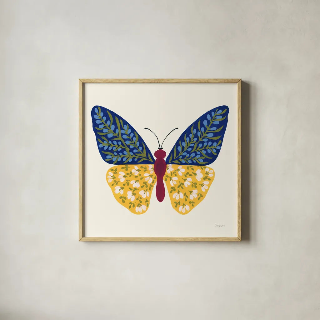 Blooming Butterfly III by Yvette St. Amant. Shown in a natural wood glass frame for a timeless modern aesthetic. Available as an archival giclee rolled canvas, fine art paper, or poster print. SKU 91174a.