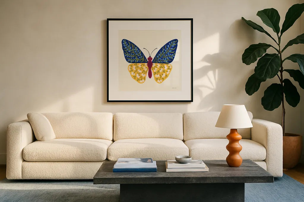 Blooming Butterfly III by Yvette St. Amant. Displayed in a glass frame with matte in a clean modern living room. Available as an archival giclee rolled canvas, fine art paper, or poster print. SKU 91174a.