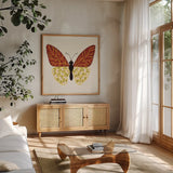 Blooming Butterfly III Vintage by Yvette St. Amant. Shown in a natural wood frame in a cozy modern living room. Available as an archival giclee rolled canvas, fine art paper, or poster print. SKU 96752a.