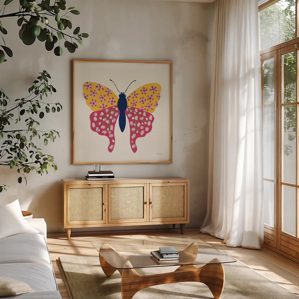 Blooming Butterfly IV by Yvette St. Amant. Shown in a natural wood frame in a cozy modern living room. Available as an archival giclee rolled canvas, fine art paper, or poster print. SKU 91175a.