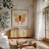 Blooming Butterfly IV Vintage by Yvette St. Amant. Shown in a natural wood frame in a cozy modern living room. Available as an archival giclee rolled canvas, fine art paper, or poster print. SKU 96753a.