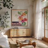 Books and Blooms II by Yvette St. Amant. Shown in a natural wood frame in a cozy modern living room. Available as an archival giclee rolled canvas, fine art paper, or poster print. SKU 97380a.