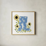 Boots with Sunflowers by Yvette St. Amant. Shown in a natural wood glass frame for a timeless modern aesthetic. Available as an archival giclee rolled canvas, fine art paper, or poster print. SKU 101177a.
