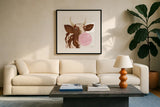 Bubblegum Cow by Yvette St. Amant. Displayed in a glass frame with matte in a clean modern living room. Available as an archival giclee rolled canvas, fine art paper, or poster print. SKU 91464a.