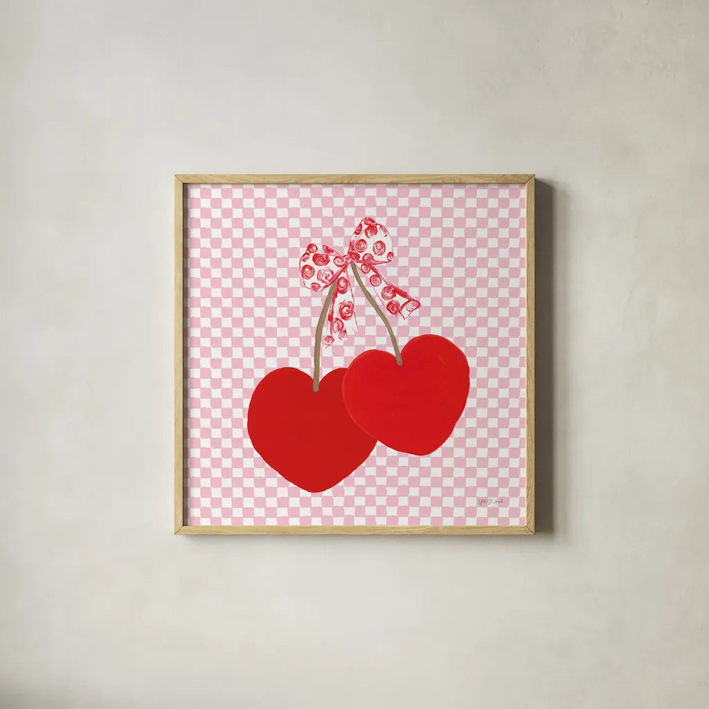 Cherry Hearts by Yvette St. Amant. Shown in a natural wood glass frame for a timeless modern aesthetic. Available as an archival giclee rolled canvas, fine art paper, or poster print. SKU 98246a.