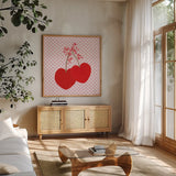 Cherry Hearts by Yvette St. Amant. Shown in a natural wood frame in a cozy modern living room. Available as an archival giclee rolled canvas, fine art paper, or poster print. SKU 98246a.