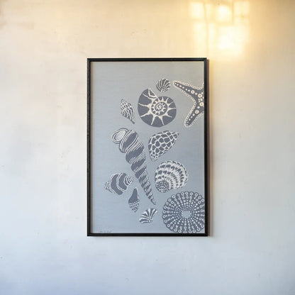 Coastal Shells I by Yvette St. Amant. shown as a paper print in a black flame. Available as a archival giclee rolled canvas, fine art paper, or poster print. SKU 88368h.