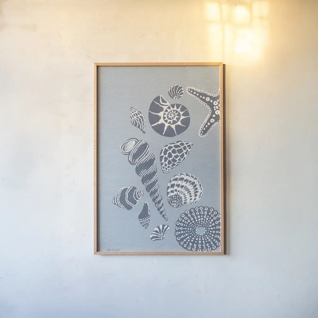 Coastal Shells I by Yvette St. Amant. shown as a paper print in a natural frame. Available as a archival giclee rolled canvas, fine art paper, or poster print. SKU 88368h.
