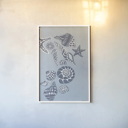 Coastal Shells II by Yvette St. Amant. shown as a paper print in a white frame. Available as a archival giclee rolled canvas, fine art paper, or poster print. SKU 88369h.