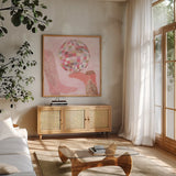 Disco Cowgirl IV by Yvette St. Amant. Shown in a natural wood frame in a cozy modern living room. Available as an archival giclee rolled canvas, fine art paper, or poster print. SKU 93449a.