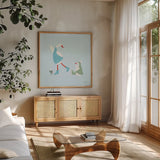 Ducks in the Snow III by Yvette St. Amant. Shown in a natural wood frame in a cozy modern living room. Available as an archival giclee rolled canvas, fine art paper, or poster print. SKU 97316a.