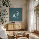 Ducks in the Snow VIII by Yvette St. Amant. Shown in a natural wood frame in a cozy modern living room. Available as an archival giclee rolled canvas, fine art paper, or poster print. SKU 97321a.