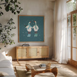 Ducks in the Snow X by Yvette St. Amant. Shown in a natural wood frame in a cozy modern living room. Available as an archival giclee rolled canvas, fine art paper, or poster print. SKU 97323a.