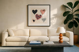 Floral Hearts by Yvette St. Amant. Displayed in a glass frame with matte in a clean modern living room. Available as an archival giclee rolled canvas, fine art paper, or poster print. SKU 94015a.