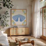 Folk Butterfly V by Yvette St. Amant. Shown in a natural wood frame in a cozy modern living room. Available as an archival giclee rolled canvas, fine art paper, or poster print. SKU 92335a.