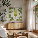 Fruity Popsicles VIII by Yvette St. Amant. Shown in a natural wood frame in a cozy modern living room. Available as an archival giclee rolled canvas, fine art paper, or poster print. SKU 93515a.