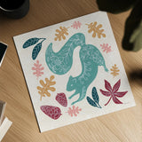 Gathering Pinecones by Yvette St. Amant. Shown as a detailed flat fine art print, highlighting archival giclee quality. Available as an archival giclee rolled canvas, fine art paper, or poster print. SKU 91384a.