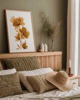 Golden Blooms I by Yvette St. Amant. shown as a paper print in a natural frame. Available as a archival giclee rolled canvas, fine art paper, or poster print. SKU 88224h.