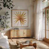 Golden Palm I by Yvette St. Amant. Shown in a natural wood frame in a cozy modern living room. Available as an archival giclee rolled canvas, fine art paper, or poster print. SKU 89175a.