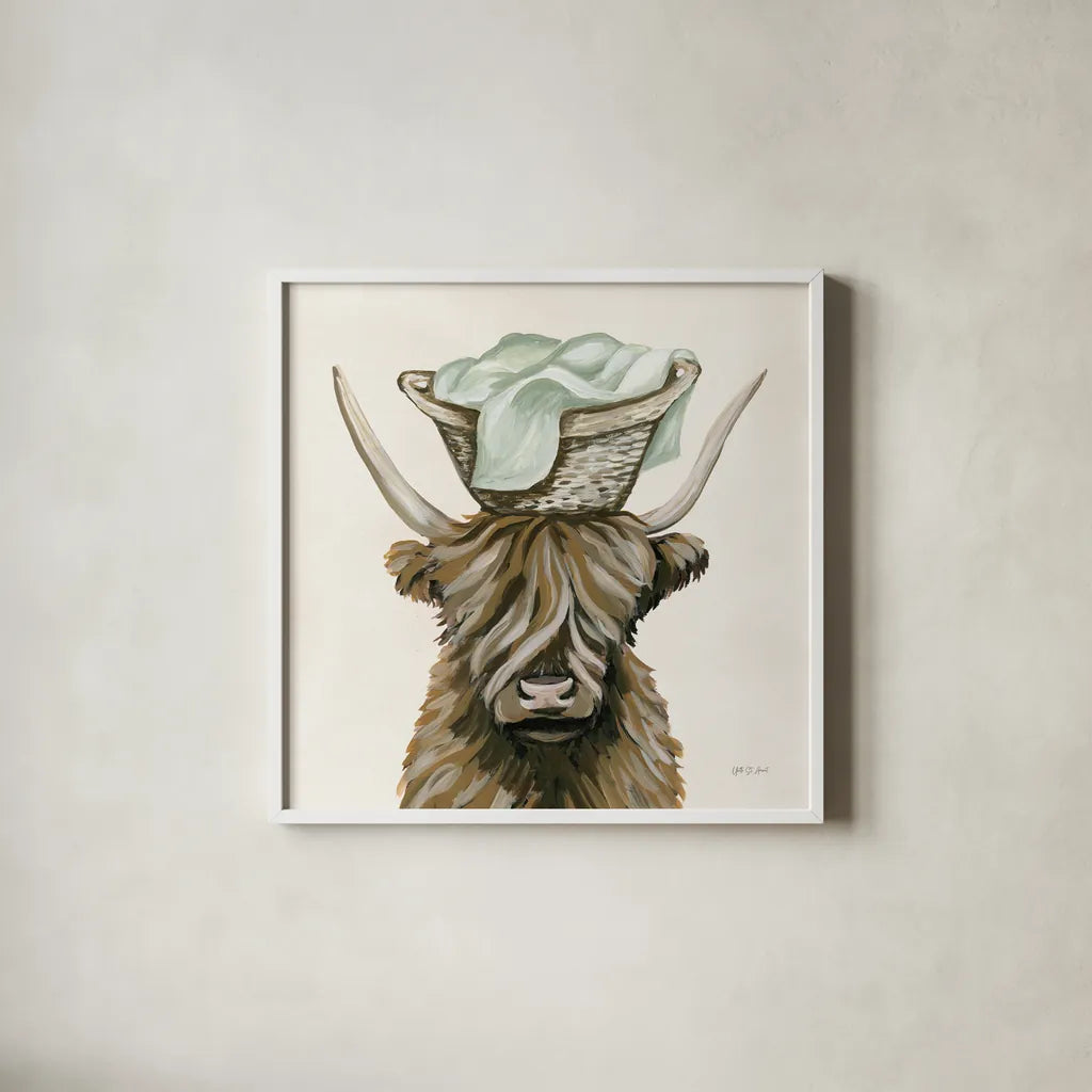Highland Cow Laundry Basket by Yvette St. Amant. Shown in a crisp white glass frame for a clean and minimalist style. Available as an archival giclee rolled canvas, fine art paper, or poster print. SKU 89453a.