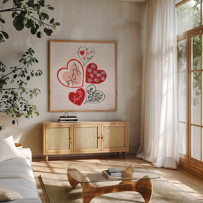 Love Hearts by Yvette St. Amant. Shown in a natural wood frame in a cozy modern living room. Available as an archival giclee rolled canvas, fine art paper, or poster print. SKU 94017a.