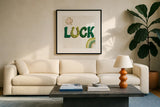Lucky Charm II by Yvette St. Amant. Displayed in a glass frame with matte in a clean modern living room. Available as an archival giclee rolled canvas, fine art paper, or poster print. SKU 100558a.