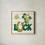 Lucky Charm IX by Yvette St. Amant. Shown in a natural wood glass frame for a timeless modern aesthetic. Available as an archival giclee rolled canvas, fine art paper, or poster print. SKU 100565a.