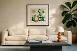 Lucky Charm IX by Yvette St. Amant. Displayed in a glass frame with matte in a clean modern living room. Available as an archival giclee rolled canvas, fine art paper, or poster print. SKU 100565a.