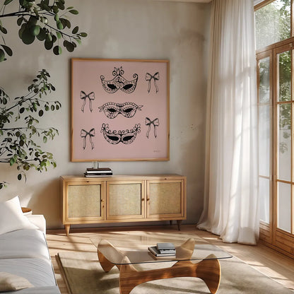 Masquerade Masks by Yvette St. Amant. Shown in a natural wood frame in a cozy modern living room. Available as an archival giclee rolled canvas, fine art paper, or poster print. SKU 93973a.