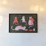 Mischief Kitty Christmas I by Yvette St. Amant. shown as a paper print in a black flame. Available as a archival giclee rolled canvas, fine art paper, or poster print. SKU 97540i.