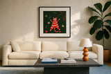 Mischief Kitty Christmas II by Yvette St. Amant. Displayed in a glass frame with matte in a clean modern living room. Available as an archival giclee rolled canvas, fine art paper, or poster print. SKU 97541a.
