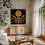 Moon Moth VI by Yvette St. Amant. Shown in a natural wood frame in a cozy modern living room. Available as an archival giclee rolled canvas, fine art paper, or poster print. SKU 101207a.