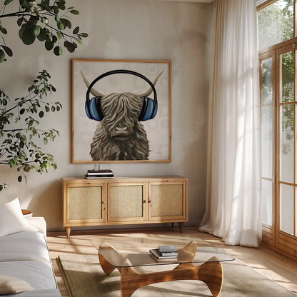 Music Cow Blue Crop by Yvette St. Amant. Shown in a natural wood frame in a cozy modern living room. Available as an archival giclee rolled canvas, fine art paper, or poster print. SKU 90161a.