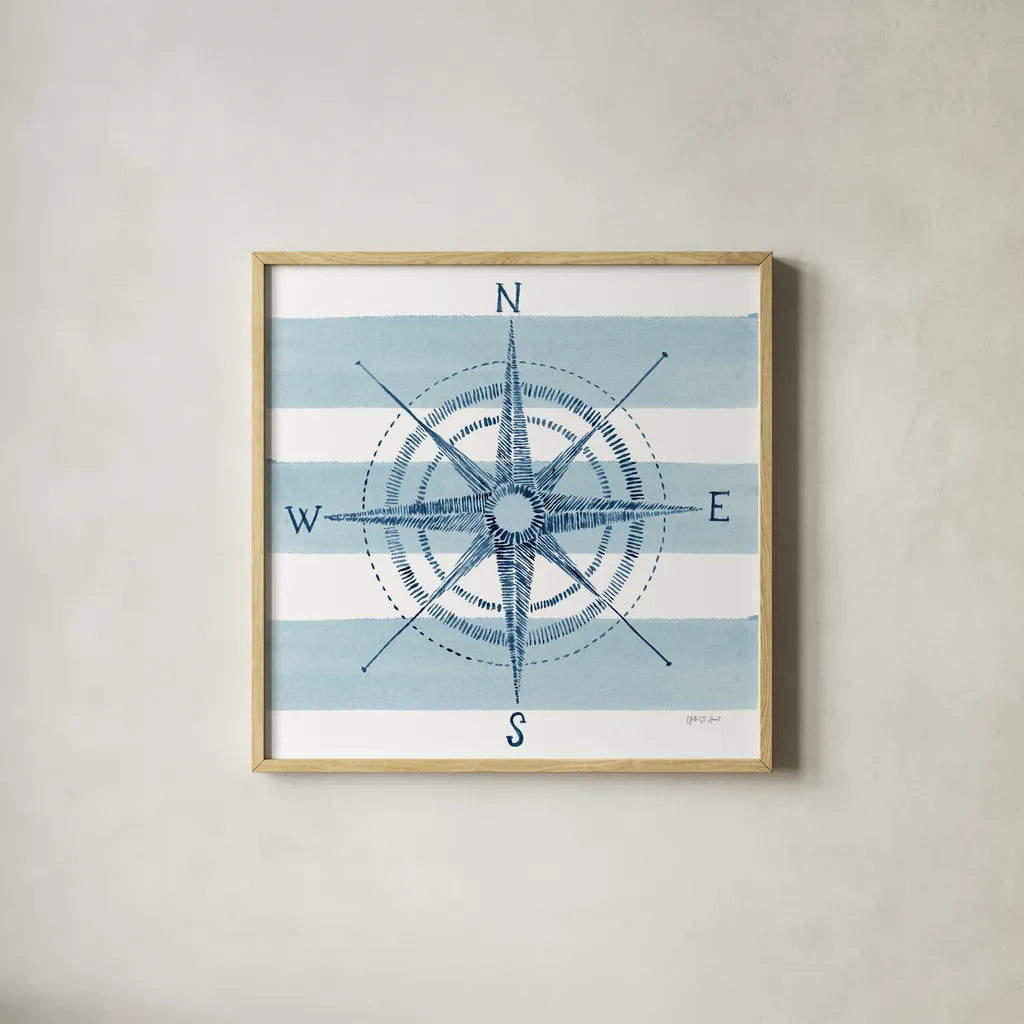 Nautical Compass by Yvette St. Amant. Shown in a natural wood glass frame for a timeless modern aesthetic. Available as an archival giclee rolled canvas, fine art paper, or poster print. SKU 90122a.
