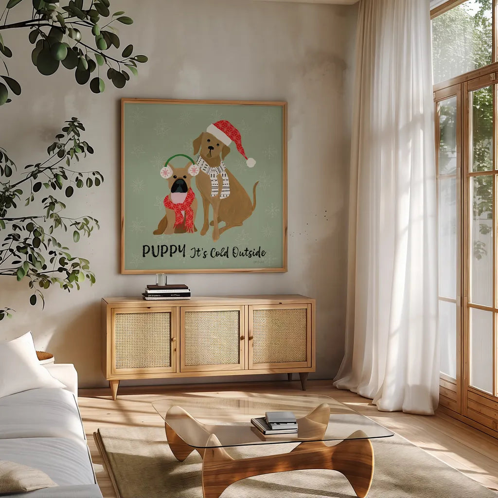 Puppy It's Cold Outside II by Yvette St. Amant. Shown in a natural wood frame in a cozy modern living room. Available as an archival giclee rolled canvas, fine art paper, or poster print. SKU 97558a.