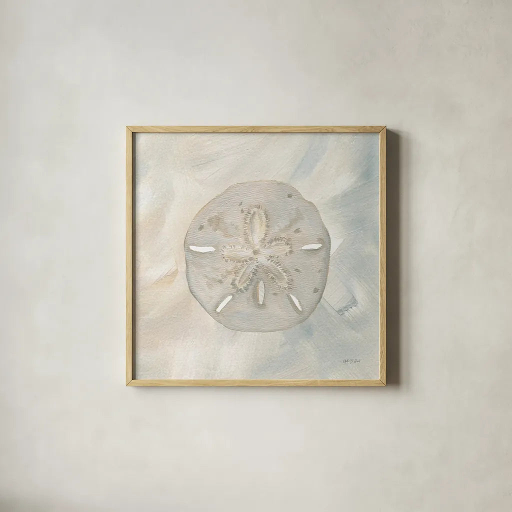 Sandollar I by Yvette St. Amant. Shown in a natural wood glass frame for a timeless modern aesthetic. Available as an archival giclee rolled canvas, fine art paper, or poster print. SKU 88517a.