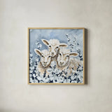 Sheep in the Meadow by Yvette St. Amant. Shown in a natural wood glass frame for a timeless modern aesthetic. Available as an archival giclee rolled canvas, fine art paper, or poster print. SKU 89495a.