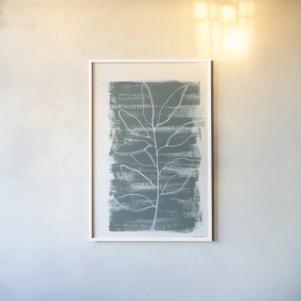 Simple Sprigs of Bay Leaf by Yvette St. Amant. shown as a paper print in a white frame. Available as a archival giclee rolled canvas, fine art paper, or poster print. SKU 93599h.