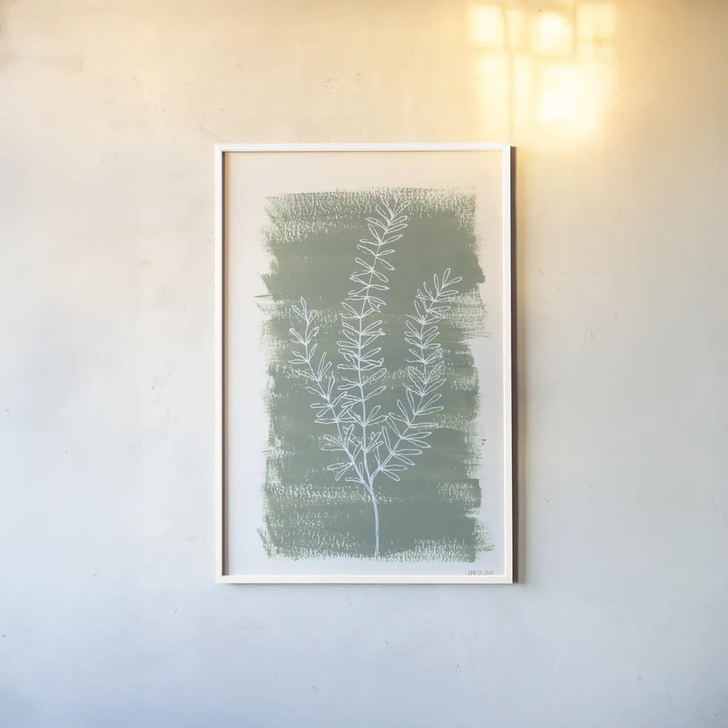 Simple Sprigs of Rosemary by Yvette St. Amant. shown as a paper print in a white frame. Available as a archival giclee rolled canvas, fine art paper, or poster print. SKU 93601h.