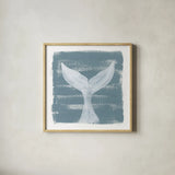 Soft Sea Whale Tail by Yvette St. Amant. Shown in a natural wood glass frame for a timeless modern aesthetic. Available as an archival giclee rolled canvas, fine art paper, or poster print. SKU 90000a.