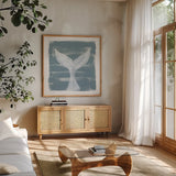 Soft Sea Whale Tail by Yvette St. Amant. Shown in a natural wood frame in a cozy modern living room. Available as an archival giclee rolled canvas, fine art paper, or poster print. SKU 90000a.