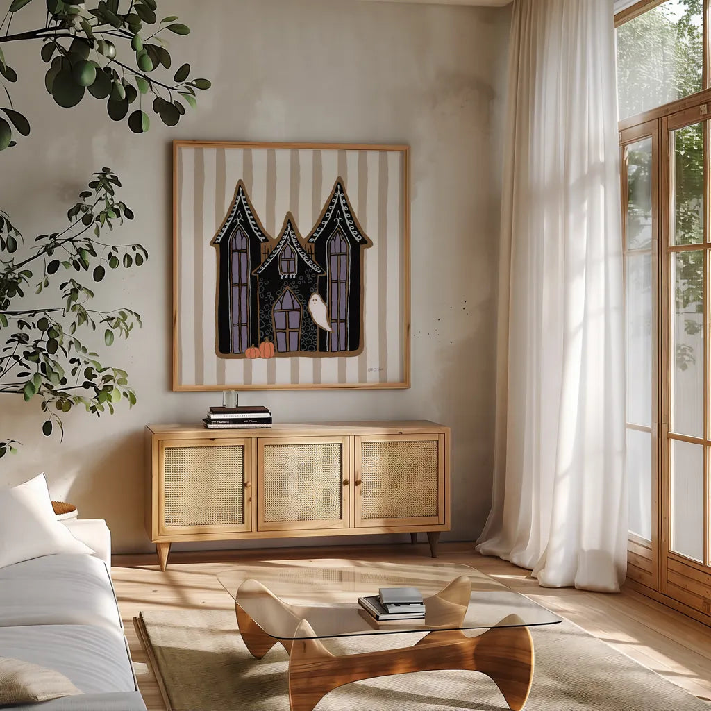 Spooky Gingerbread Manor I by Yvette St. Amant. Shown in a natural wood frame in a cozy modern living room. Available as an archival giclee rolled canvas, fine art paper, or poster print. SKU 101109a.