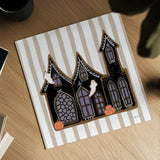 Spooky Gingerbread Manor II by Yvette St. Amant. Shown as a detailed flat fine art print, highlighting archival giclee quality. Available as an archival giclee rolled canvas, fine art paper, or poster print. SKU 101110a.
