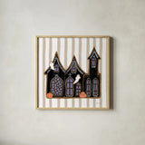 Spooky Gingerbread Manor II by Yvette St. Amant. Shown in a natural wood glass frame for a timeless modern aesthetic. Available as an archival giclee rolled canvas, fine art paper, or poster print. SKU 101110a.