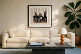 Spooky Gingerbread Manor II by Yvette St. Amant. Displayed in a glass frame with matte in a clean modern living room. Available as an archival giclee rolled canvas, fine art paper, or poster print. SKU 101110a.
