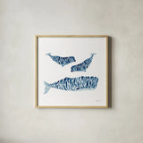 Three Whales by Yvette St. Amant. Shown in a natural wood glass frame for a timeless modern aesthetic. Available as an archival giclee rolled canvas, fine art paper, or poster print. SKU 90118a.