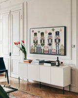 Vintage Nutcrackers I by Yvette St. Amant. shown as a framed stretched canvas in a living room above a console. Available as a archival giclee rolled canvas, fine art paper, or poster print. SKU 94711i.